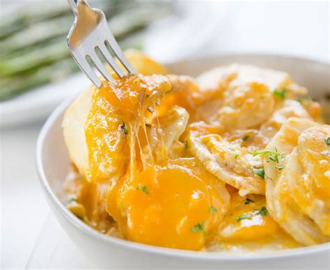 These easy crock pot scalloped potatoes are a cinch to prepare and cook in the slow cooker with a simple white sauce and shredded cheese. Cheesy Crockpot Scalloped Potatoes | Recipe in 2020 ...