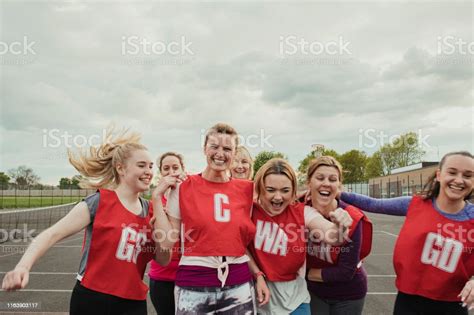 Female Netball Team Celebrating A Win Stock Photo Download Image Now