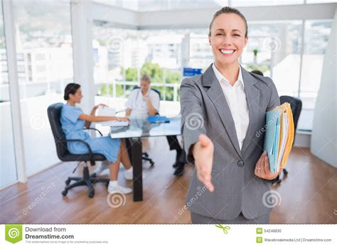 Smiling Businesswoman Introducing Herself Stock Photo - Image of adult, colleague: 54248830