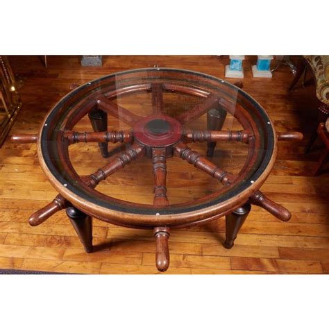 This impressive wagon wheel styled coffee table will make a delightful and functional addition to your home. Antique Ship's Wheel Coffee Table | Chairish