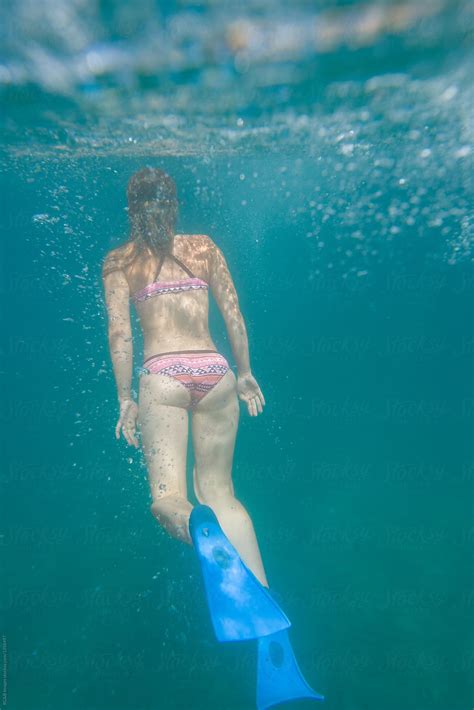 caucasian woman scuba diving underwater by stocksy contributor ibex media stocksy