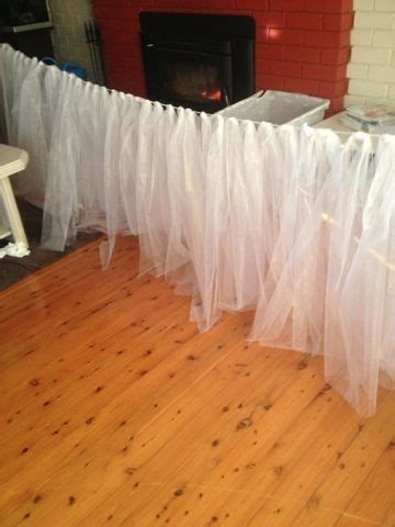 Here at efavormart, we have always been in love with table skirts. DIY bridal Table skirting for $12 with string/rope/fishing line and tulle. GREAT IDEA!! Pretty ...
