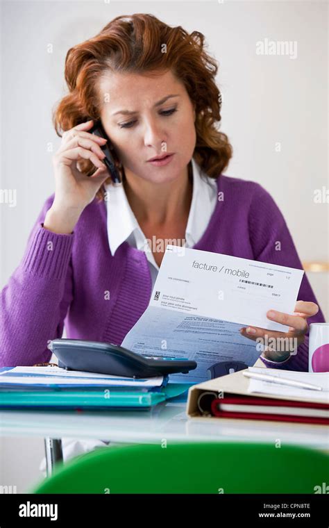 Woman Doing Paperwork Stock Photo Alamy