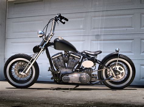 a motorcycle parked in front of a garage door