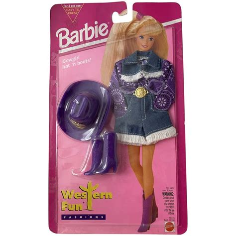The Barbie Doll Is Wearing A Purple Outfit