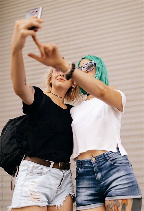 Lesbian Couple Women Making A Selfie On The Street By Stocksy