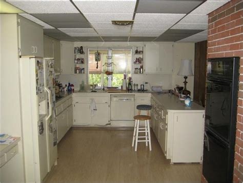 Flip the circuit breaker to the ceiling lights located in the drop ceiling. Drop ceiling in kitchen...Replace it or update it?