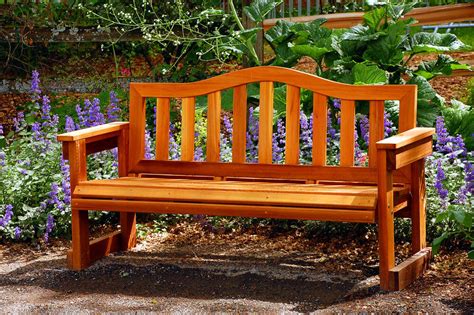 While it has a thick wooden slab as a seat and two thinner ones as legs, both have rounded edges and a brace connects the legs, which sets it apart from others. 60 Garden Bench Ideas (Photos)