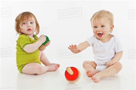 Two Babies Playing Together Stock Photo Dissolve