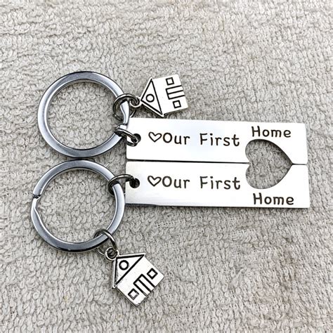 Our First Home Matching Heart Couple Keychains In Stainless Steel