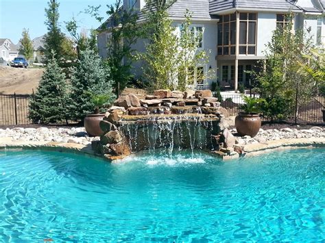 This kansas city pool offers a play pool, family pool (ideal for younger kids), lazy river and the bayrider. Blue Haven Pools of Kansas City - custom grotto waterfall ...