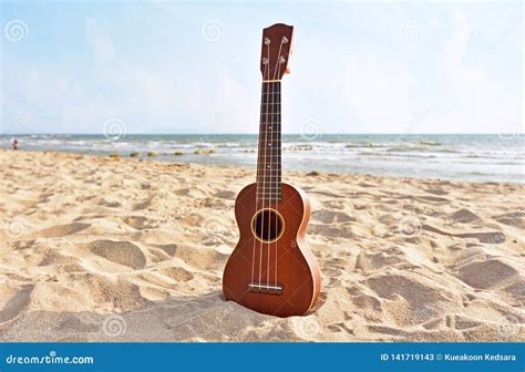 Ukulele on the Beautiful Summer Beach Stock Image - Image of guitar