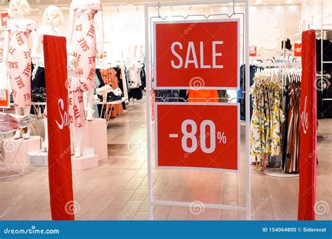 Sale And Discount Banners In A Women`s Clothing Retail Store Stock