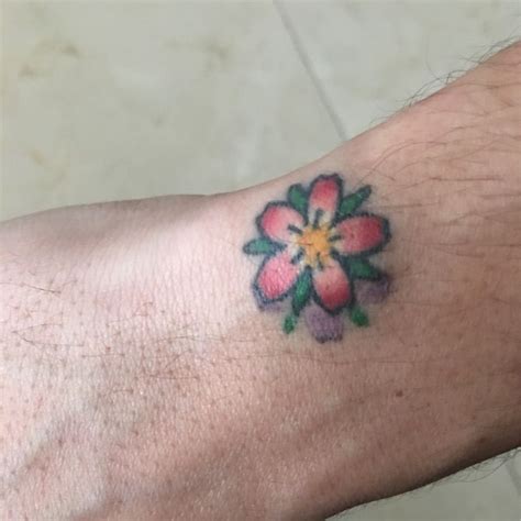 Often referred to as metro; John Mayer's wrist tattoo- Flower blossom | Peach tattoo ...