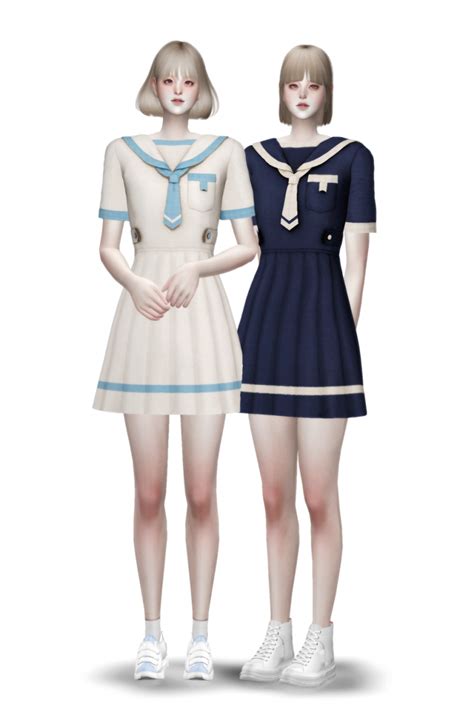 Two Women Standing Next To Each Other Wearing Sailors Uniforms And