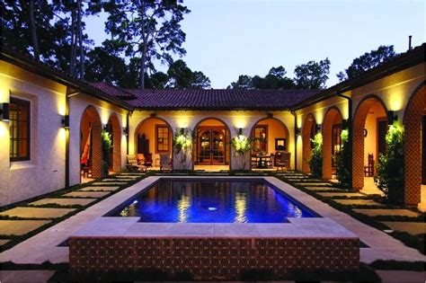 The exterior styling reflects america's southwestern, central american, and andalusian influences. Spanish House Plans with Inner Courtyard | plougonver.com