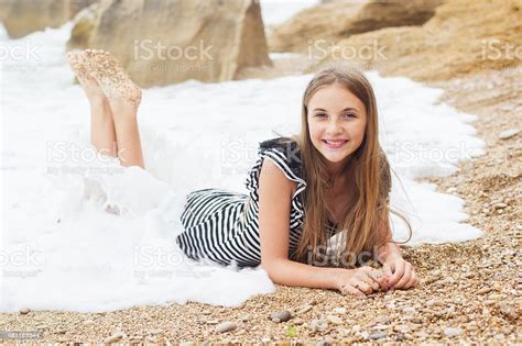 Teen Girl Is Wearing Stripped Dress On The Beach Stock Photo More