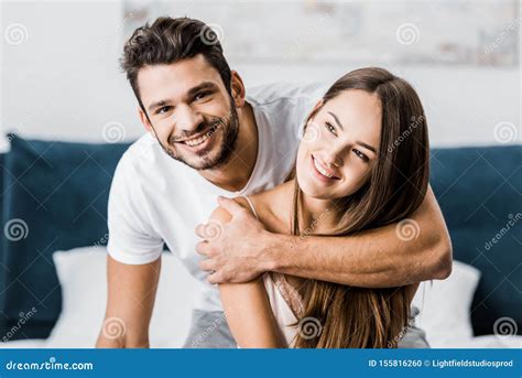 Young Happy Man Hugging Girlfriend And Stock Photo Image Of Male