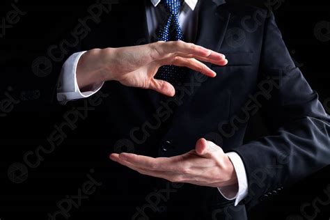 Man Holding His Hands Out And Showing Something Stock Photo