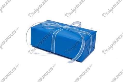 Gift Box Wrapped In Trendy Blue Paper On White Background