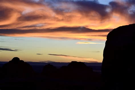 Sunrise Through Partition Arch In Arches National Park Scenery