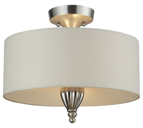 When we moved into our current rental, it had a hideous ceiling fan and light hanging in just about the oddest place you could put it. ELK Lighting Two Light Silver Leaf Drum Shade Semi-Flush ...