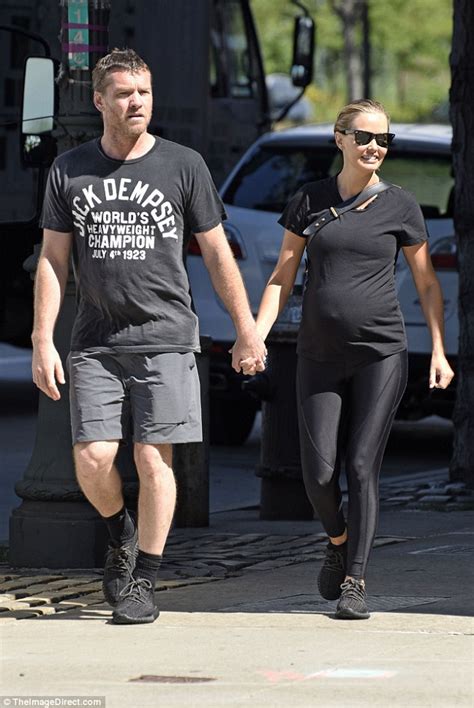 Lara Bingle Holds Hands With Husband Sam Worthington During Stroll In