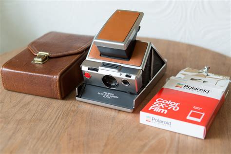 polaroid sx 70 land camera alpha 1 with carrying case and film vintage brown photography camera