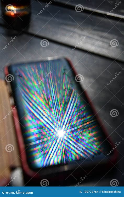 Spectrum Rays Shine On Phone Screen With Abstract Reflection Stock