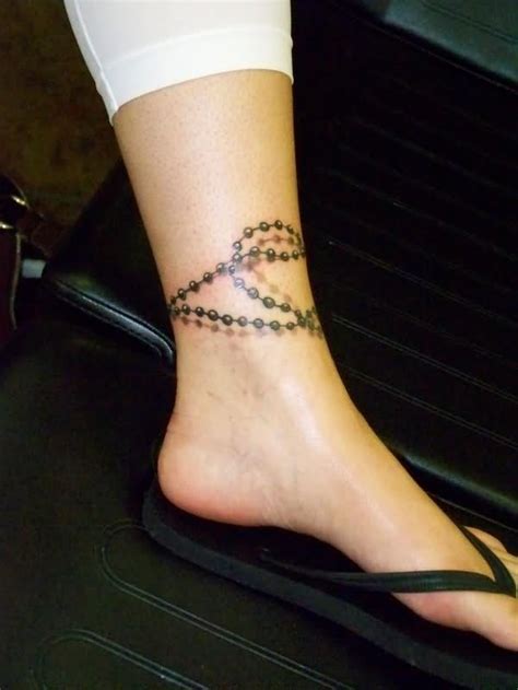 Horrible grey color ink feminine twin bows tattoos on ankles for girls. 101 Ankle Tattoo Designs that will flaunt your Walk