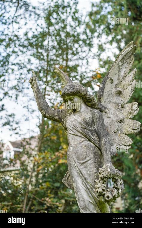 Front View Of Stone Angel Memorial Statue With Wings Isolated In A Uk