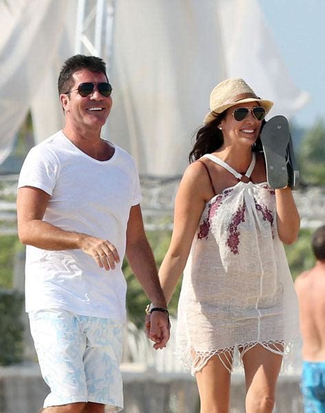 simon cowell holds hands with his pregnant girlfriend lauren silverman