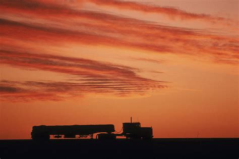 A Silhouette Of A Truck Seen At Sunset Photograph By Peter Essick Pixels