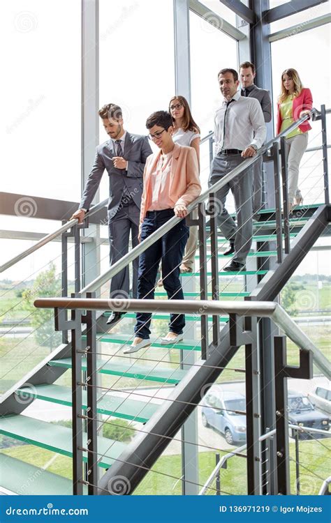 Business People Walking Down Stairs Stock Image Image Of Aged