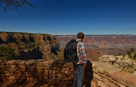 A Man With A Backpack Visiting The Grand Canyon Stock Image Image Of