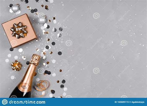 Flat Lay Composition Of Champagne Gift Box And Confetti