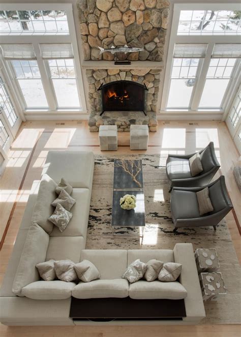 A Dramatic Floor To Ceiling Stone Fireplace Is The Focal Point In This