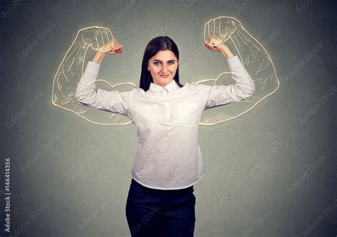 Powerful Girl Flexing Her Muscles Stock Photo Adobe Stock