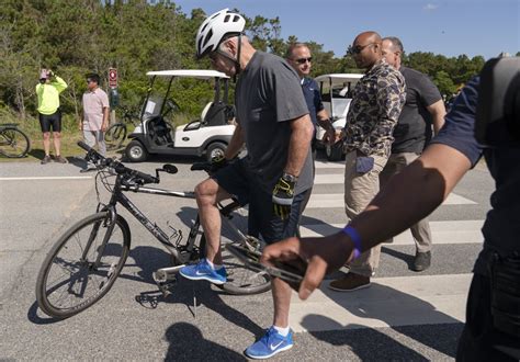 Biden Takes Spill While Getting Off Bike After Beach Ride Wtop News