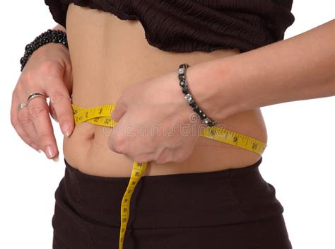 Wrap the measuring tape completely around your waist starting at the belly button. Waist measurement stock photo. Image of diet, skinny ...