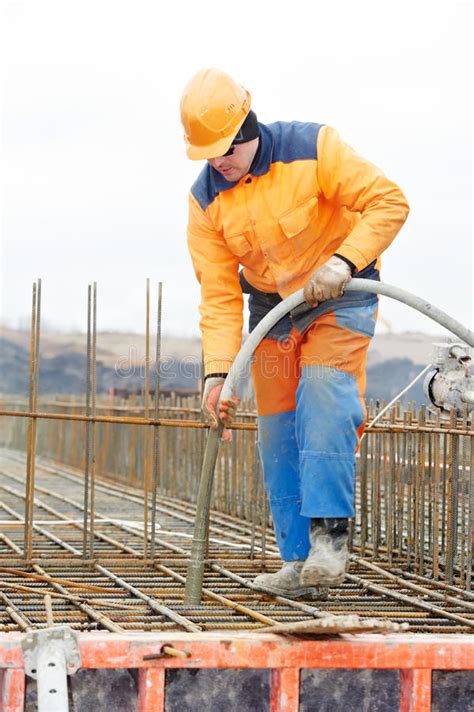 Builder Worker Vibrating Concrete in Form Stock Photo - Image of