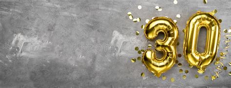 Yellow Foil Balloon Number Number Thirty On A Concrete Background