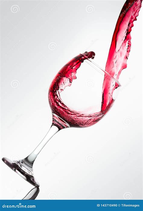 Wave Formed On The Pouring Of Red Wine On A Glass Stock Photo Image