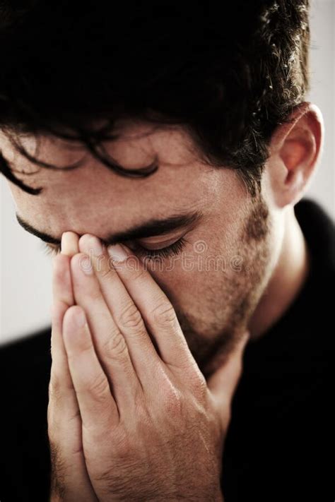 Praying Desperately A Young Man With His Hands Over His Mouth In