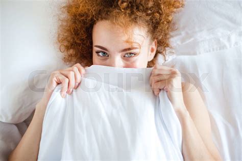Shy Cute Lovely Young Woman Hiding Her Face Behind Sheet Stock Image