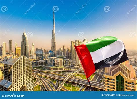Amazing Dubai Skyline Cityscape With Modern Skyscrapers And Uae Flag