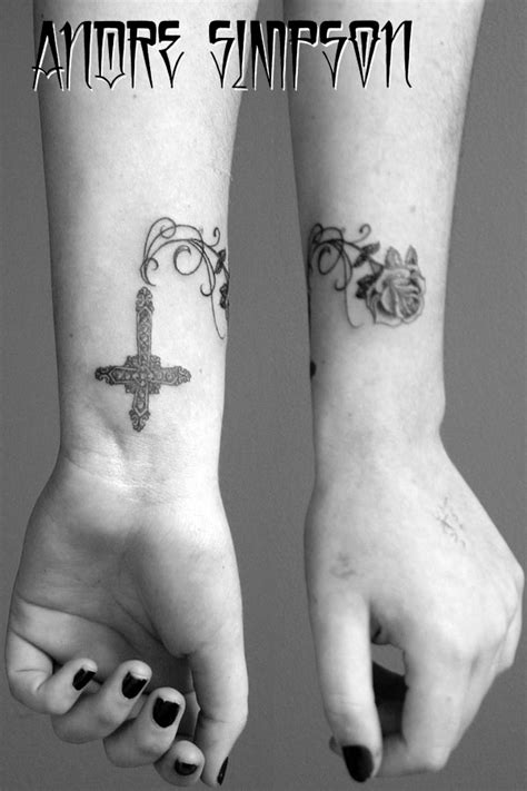 This black and white tattoo that has vines as well as smaller roses. Cross Vines And Rose Tattoo Design Pictures