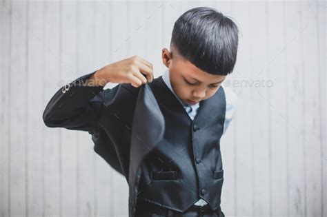 Boy Is Wearing A Suit Stock Photo By Garakta Studio Photodune