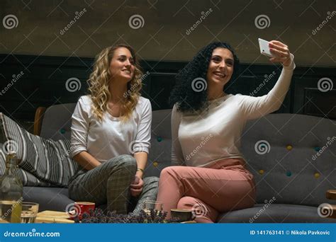 Two Best Girlfriends Are Taking Selfie In Cafe Stock Image Image Of Fashionable Adult 141763141