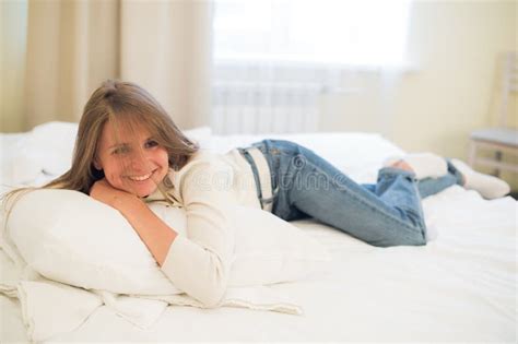 smiling thoughtful pretty woman lying in bed at home stock image image of looking body 88859333